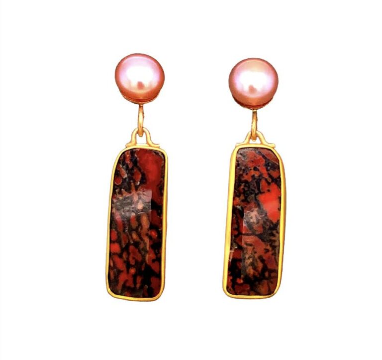 Top Petrified Dinosaur Bone earrings set with pink Tahitian Pearls