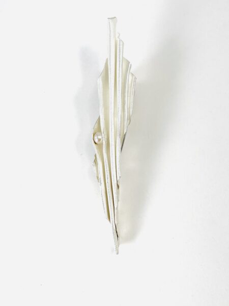 Fold formed sterling silver brooch with pearl