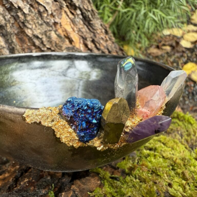 Hand thrown ceramic bowl with inset crystals.