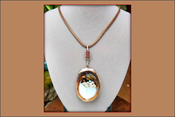 Slipper shell with opal